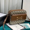 Женская кожаная сумка Gucci с рисунком и коричневыми вставками 23/17 см фото-1